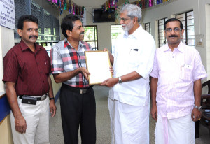 receiving award from B D Devassy MLA